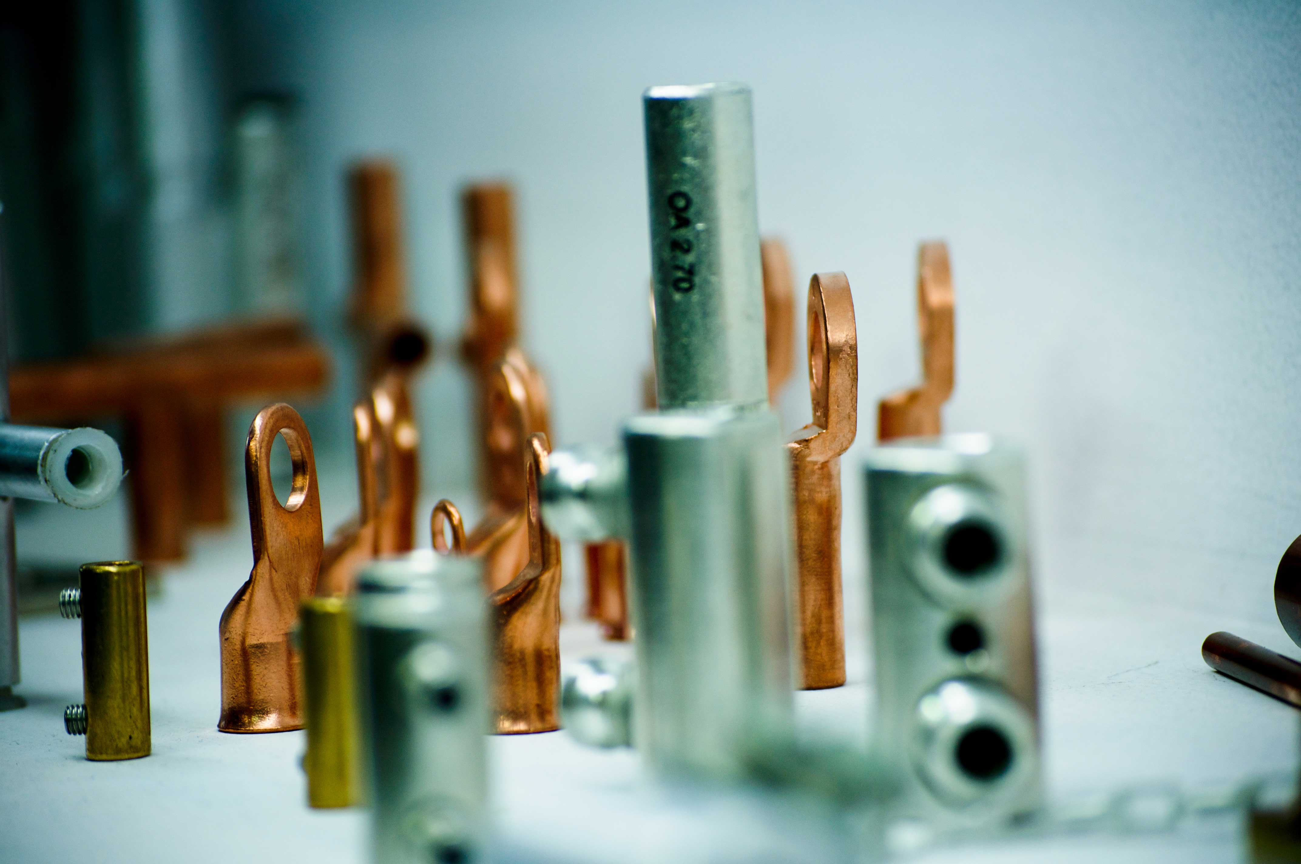 metal cable lugs displayed on a table